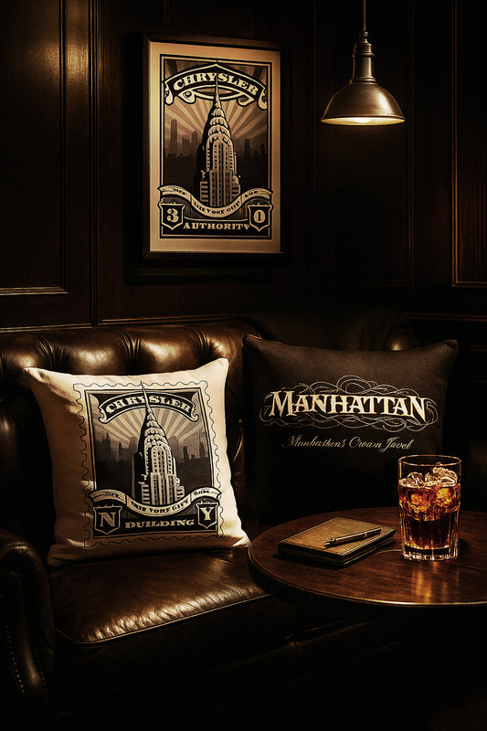 Chrysler Building Landmark Holiday Bundle featuring framed black and white stamp art print, matching throw pillow, and tote displayed in a warm urban setting, celebrating the Art Deco architecture of the Chrysler Building.