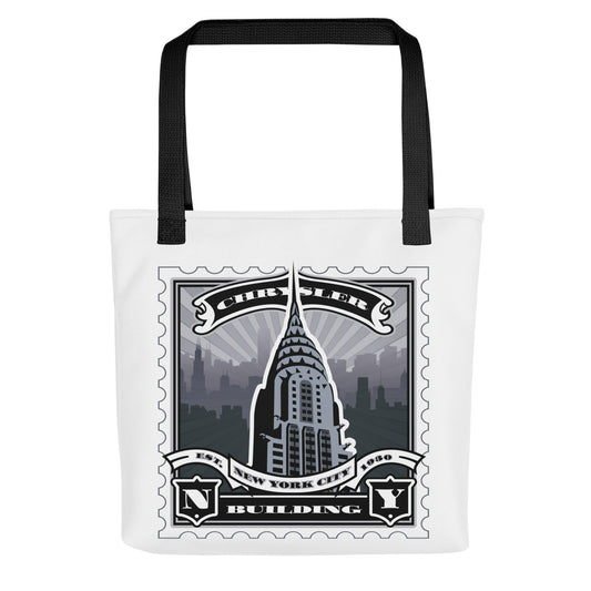 Canvas tote with Chrysler Building spire illustrated in a vintage stamp design, white body, black handles, Art Deco skyline detail.