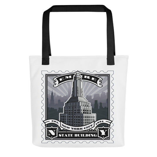 White canvas tote with Empire State Building vintage stamp illustration, black handles, detailed skyline silhouette.