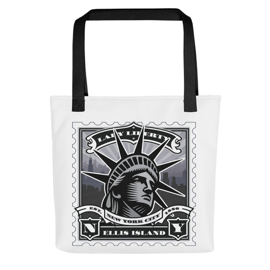 White canvas tote with Flatiron Building vintage stamp illustration, black handles, triangular wedge and facade detail.